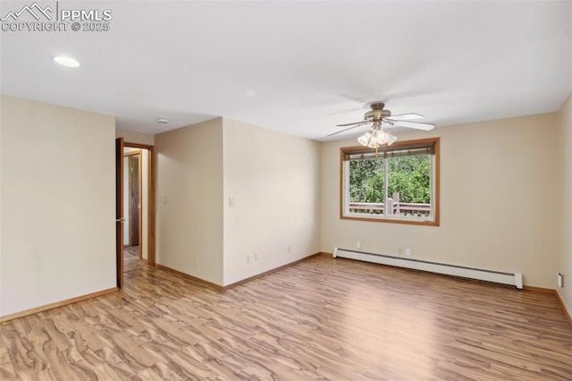 22 Puma Path, Manitou Springs, CO 80829 - empty room with a baseboard heating unit, a ceiling fan, wood finished floors, and recessed lighting