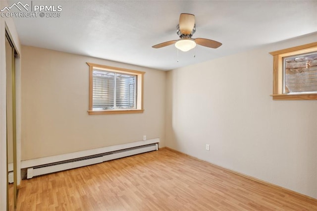 22 Puma Path, Manitou Springs, CO 80829 - spare room with baseboard heating, wood finished floors, and a ceiling fan
