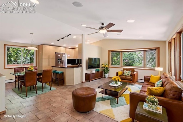22 Puma Path, Manitou Springs, CO 80829 - living room with plenty of natural light, lofted ceiling, ceiling fan, recessed lighting, and a baseboard radiator