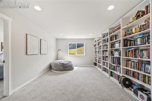 5446 Mesa Top Dr, Monument, CO 80132 - living area with carpet, recessed lighting, and bookshelves