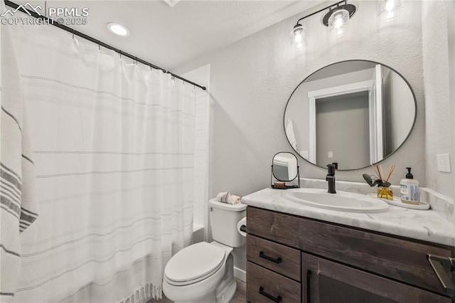 5446 Mesa Top Dr, Monument, CO 80132 - full bathroom featuring vanity, a textured wall, and shower / tub combo with curtain