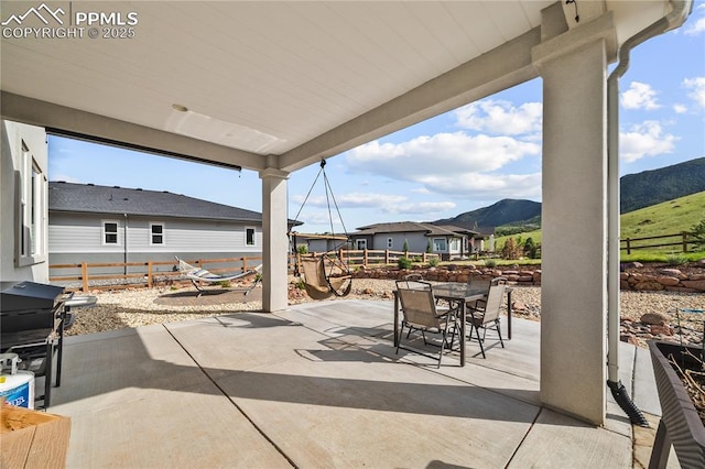 5446 Mesa Top Dr, Monument, CO 80132 - view of patio with outdoor dining area, a mountain view, and grilling area