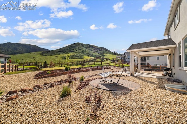 5446 Mesa Top Dr, Monument, CO 80132 - view of yard featuring a mountain view and a patio area