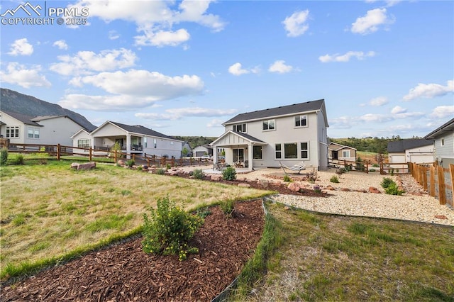 5446 Mesa Top Dr, Monument, CO 80132 - rear view of house featuring a patio area and a fenced backyard