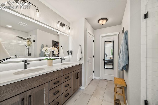 5446 Mesa Top Dr, Monument, CO 80132 - full bath with double vanity, a shower stall, and tile patterned flooring