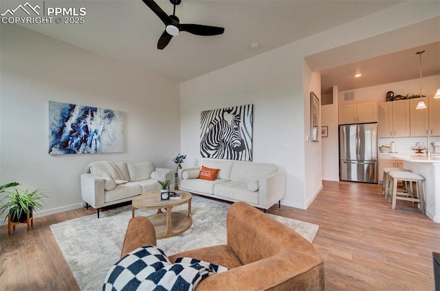 2186 Keara Hts, Colorado Springs, CO 80919 - living room featuring light wood finished floors and a ceiling fan