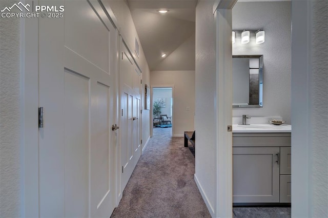 2186 Keara Hts, Colorado Springs, CO 80919 - hall with carpet floors and lofted ceiling
