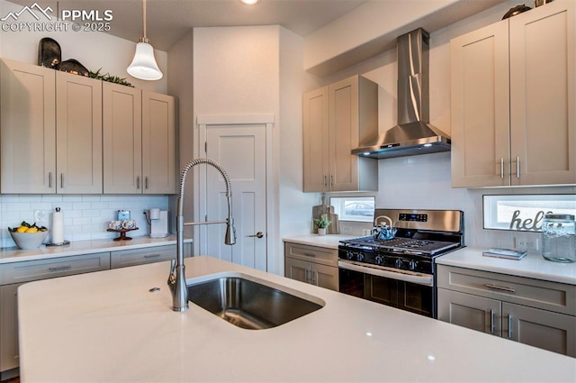 2186 Keara Hts, Colorado Springs, CO 80919 - kitchen featuring wall chimney exhaust hood, stainless steel gas stove, and light countertops