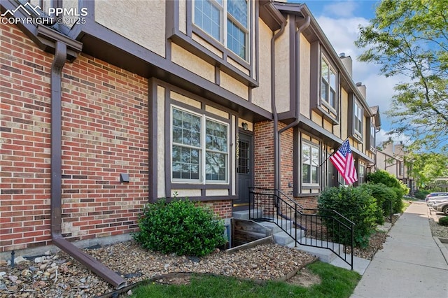 5585 Tamworth Dr, Colorado Springs, CO 80919 - view of home's exterior featuring stucco siding and brick siding