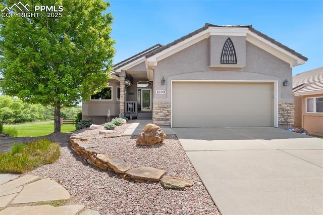 1690 Doe Run Pt, Colorado Springs, CO 80919 - ranch-style house featuring stone siding, concrete driveway, an attached garage, and stucco siding