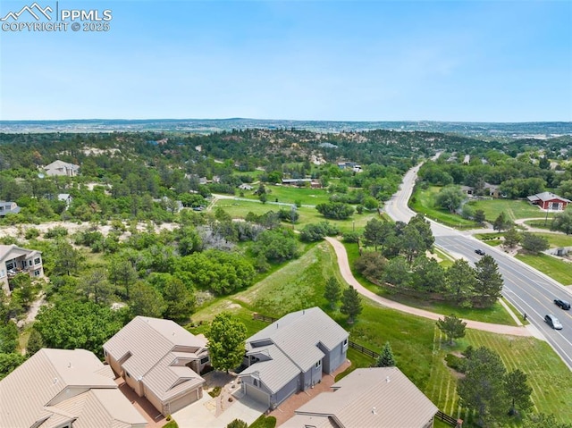 1690 Doe Run Pt, Colorado Springs, CO 80919 - aerial view of residential area with a tree filled landscape