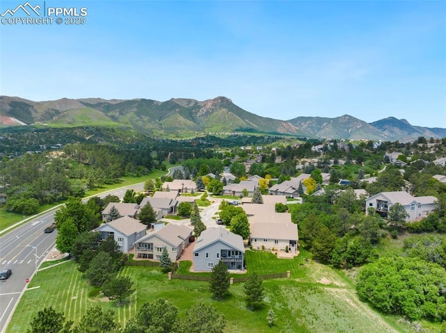 1690 Doe Run Pt, Colorado Springs, CO 80919 - aerial view of residential area featuring a mountainous background