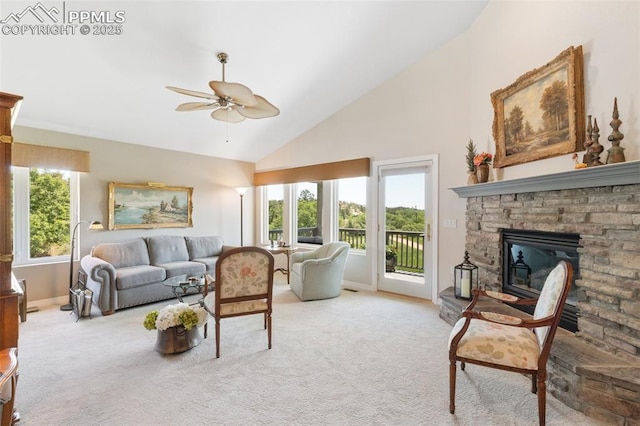 1690 Doe Run Pt, Colorado Springs, CO 80919 - living room with a ceiling fan, light colored carpet, high vaulted ceiling, and a fireplace