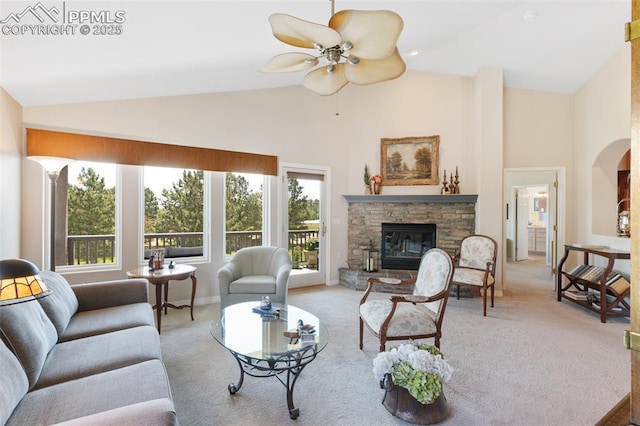 1690 Doe Run Pt, Colorado Springs, CO 80919 - living area featuring carpet floors, high vaulted ceiling, a fireplace, and a ceiling fan