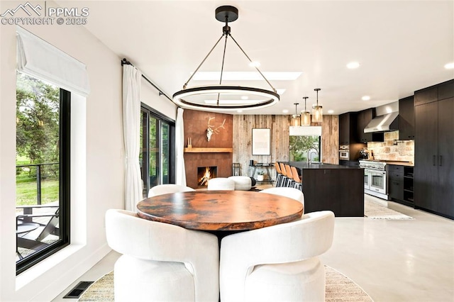 18910 Augusta Dr, Monument, CO 80132 - dining space with recessed lighting, a fireplace, and a chandelier
