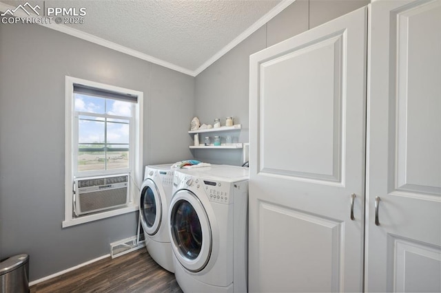 5664 Southfork Dr, Peyton, CO 80831 - laundry room with washer and dryer, ornamental molding, dark wood-style flooring, a textured ceiling, and cooling unit