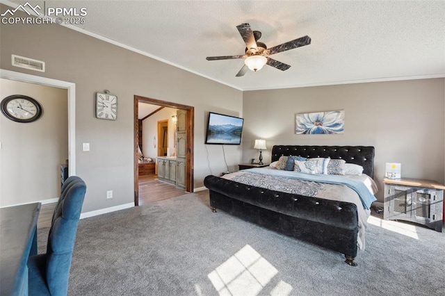 5664 Southfork Dr, Peyton, CO 80831 - carpeted bedroom with crown molding, a textured ceiling, ensuite bathroom, and a ceiling fan