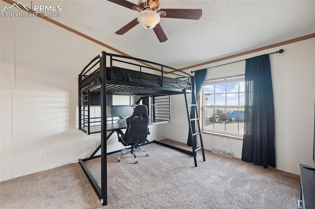 5664 Southfork Dr, Peyton, CO 80831 - bedroom featuring carpet flooring, a textured ceiling, an office area, and ornamental molding