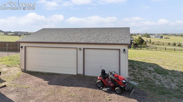 5664 Southfork Dr, Peyton, CO 80831 - detached garage featuring a rural view