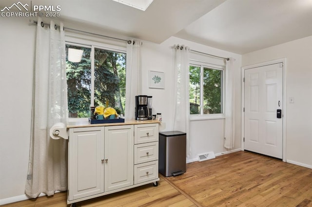 906 Bowser Dr, Colorado Springs, CO 80909 - entryway with light wood-style flooring and baseboards
