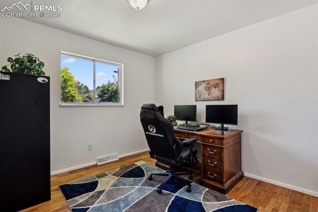 906 Bowser Dr, Colorado Springs, CO 80909 - office space with baseboards and wood finished floors