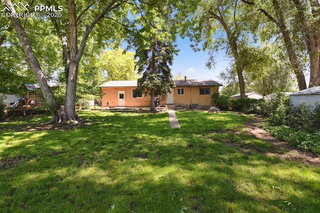 906 Bowser Dr, Colorado Springs, CO 80909 - view of green lawn