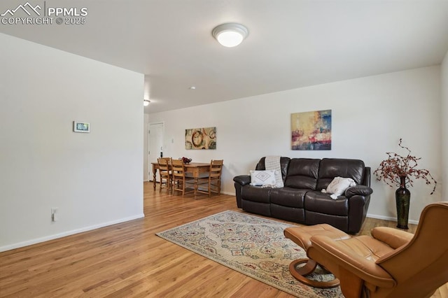 906 Bowser Dr, Colorado Springs, CO 80909 - living area featuring light wood-style floors and baseboards