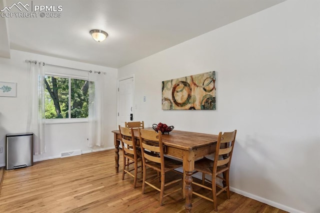 906 Bowser Dr, Colorado Springs, CO 80909 - dining room with light wood finished floors and baseboards