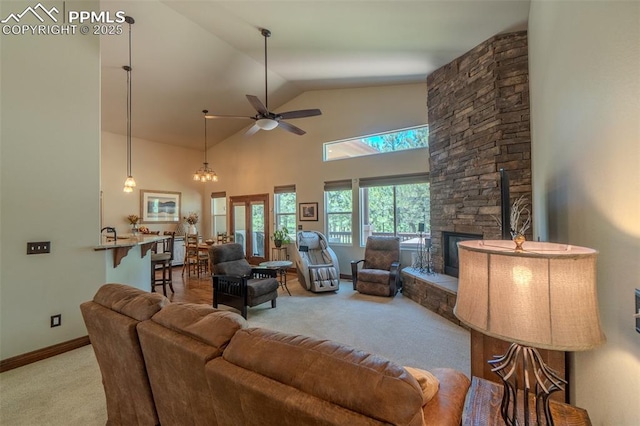 15324 Pole Pine Pt, Colorado Springs, CO 80908 - carpeted living room featuring a ceiling fan, a fireplace, and high vaulted ceiling