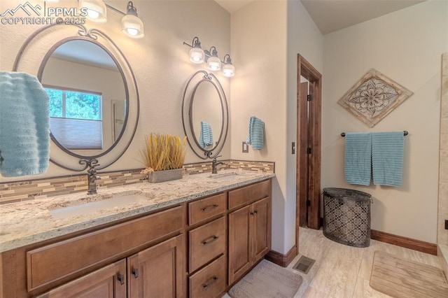15324 Pole Pine Pt, Colorado Springs, CO 80908 - full bath featuring double vanity and baseboards