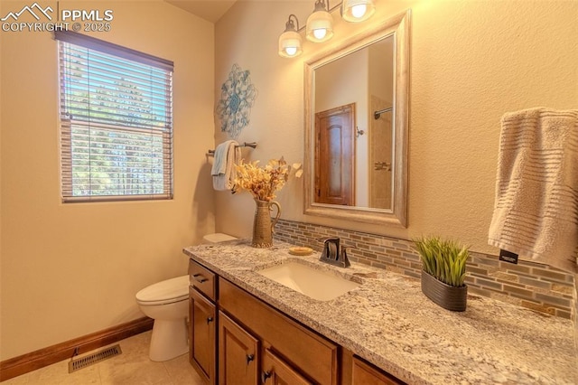 15324 Pole Pine Pt, Colorado Springs, CO 80908 - full bathroom with vanity, tasteful backsplash, and tile patterned floors