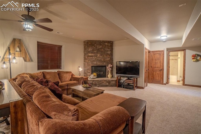 15324 Pole Pine Pt, Colorado Springs, CO 80908 - carpeted living room with ceiling fan and a fireplace