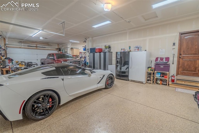 15324 Pole Pine Pt, Colorado Springs, CO 80908 - garage featuring freestanding refrigerator