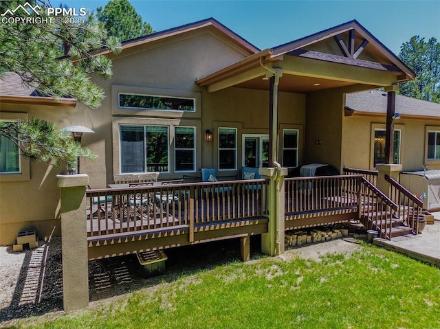 15324 Pole Pine Pt, Colorado Springs, CO 80908 - back of property with stucco siding, a deck, and a yard