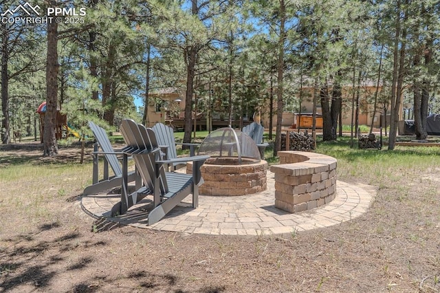 15324 Pole Pine Pt, Colorado Springs, CO 80908 - view of patio featuring a fire pit