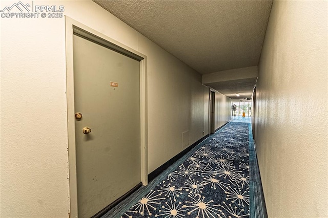 411 Lakewood Cir Unit B527, Colorado Springs, CO 80910 - hall with a textured ceiling