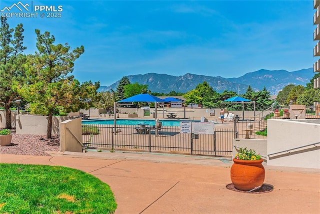 411 Lakewood Cir Unit B527, Colorado Springs, CO 80910 - community pool featuring a mountain view