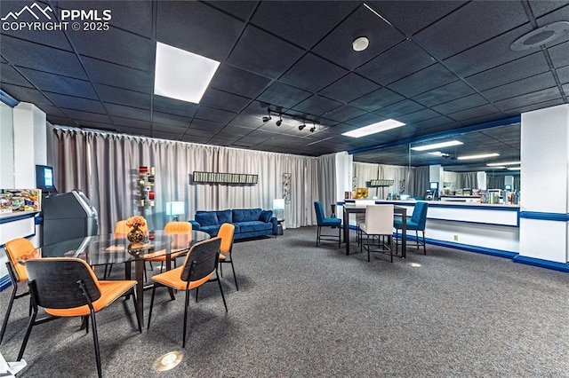 411 Lakewood Cir Unit B527, Colorado Springs, CO 80910 - carpeted dining area with a drop ceiling