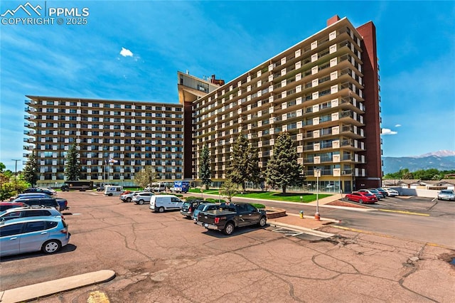 411 Lakewood Cir Unit B527, Colorado Springs, CO 80910 - view of property featuring uncovered parking and a mountain view