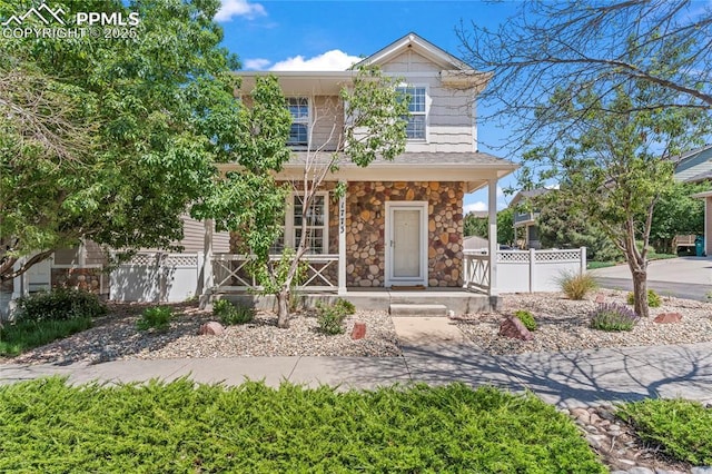 1773 Herd St, Colorado Springs, CO 80910 - view of front facade with a porch and stone siding