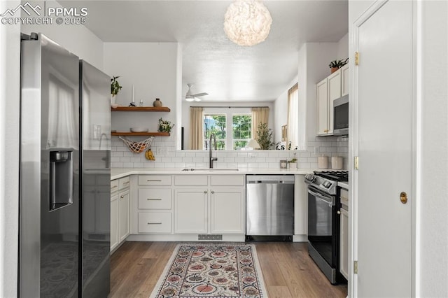 1773 Herd St, Colorado Springs, CO 80910 - kitchen featuring stainless steel appliances, light countertops, and decorative backsplash