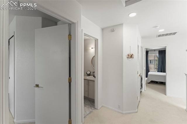 1773 Herd St, Colorado Springs, CO 80910 - hallway with light colored carpet and recessed lighting