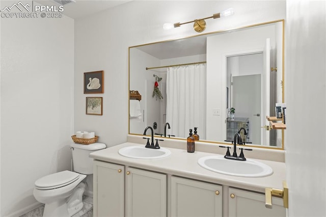 1773 Herd St, Colorado Springs, CO 80910 - bathroom featuring double vanity and curtained shower