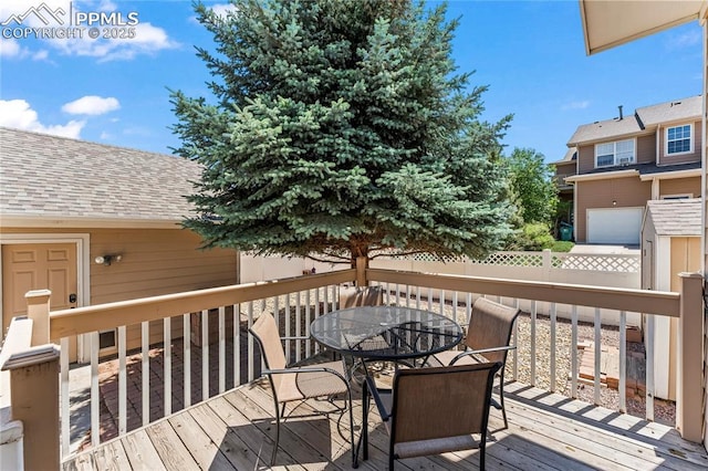 1773 Herd St, Colorado Springs, CO 80910 - wooden deck featuring outdoor dining area