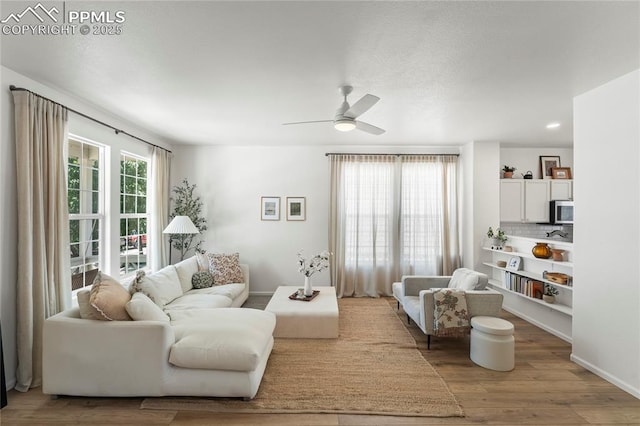 1773 Herd St, Colorado Springs, CO 80910 - living room with wood finished floors, a ceiling fan, and recessed lighting
