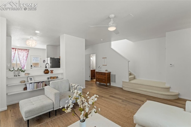 1773 Herd St, Colorado Springs, CO 80910 - living room with stairway, wood finished floors, and ceiling fan