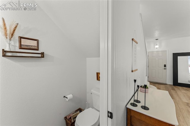 1773 Herd St, Colorado Springs, CO 80910 - bathroom featuring wood finished floors and toilet