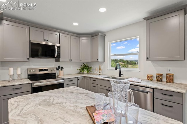 110 Fox Hill Ln, Colorado Springs, CO 80919 - kitchen featuring appliances with stainless steel finishes, gray cabinetry, recessed lighting, and light stone countertops