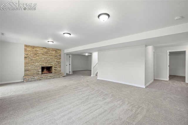 110 Fox Hill Ln, Colorado Springs, CO 80919 - unfurnished living room with carpet, stairs, and a stone fireplace