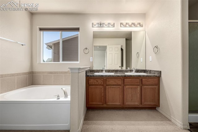 5718 Badenoch Ter, Colorado Springs, CO 80923 - bathroom with double vanity and a garden tub